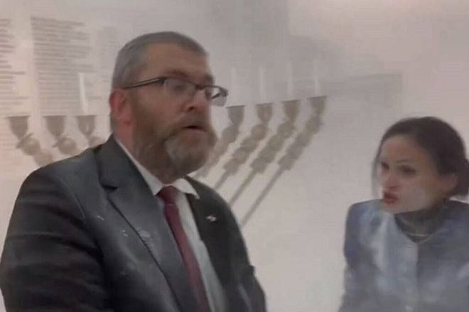 Polish lawmaker Grzegorz Braun after extinguishing a Chanukah menorah at the parliament building in Warsaw, Dec. 12, 2023. Source: Screenshot/X.