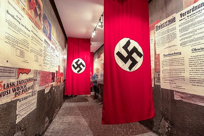 Nazi swastika flags in Oskar Schindler's enamel factory museum in Krakow, Poland, on June 3, 2018. Credit: agsaz/Shutterstock.