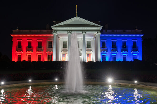 The White House is lit in red, white and blue in support of Team USA in the Paris Summer Olympics, July 26, 2024. Credit: Abe McNatt/White House.