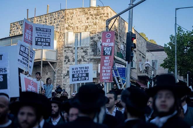 Ultra-Orthodox extremists attend a rally in Jerusalem's Mea Shearim neighborhood against the enlistment of haredi Jews into the Israel Defense Forces, June 30, 2024. Photo by Chaim Goldberg/Flash90.