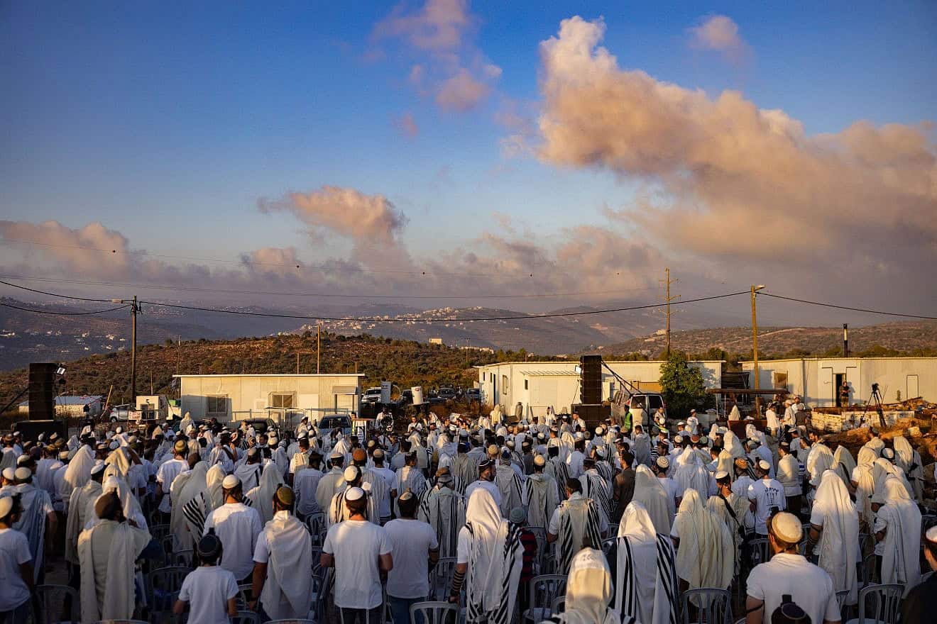 Israelis attend a special prayer event in the newly recognized town of Evyatar in Samaria, July 7, 2024. Photo by Chaim Goldberg/Flash90.