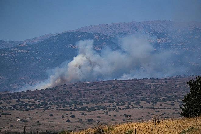 Smoke rises after missiles fired from Lebanon hit open areas in the northern Golan Heights, July 10, 2024. Photo by Ayal Margolin/Flash90.