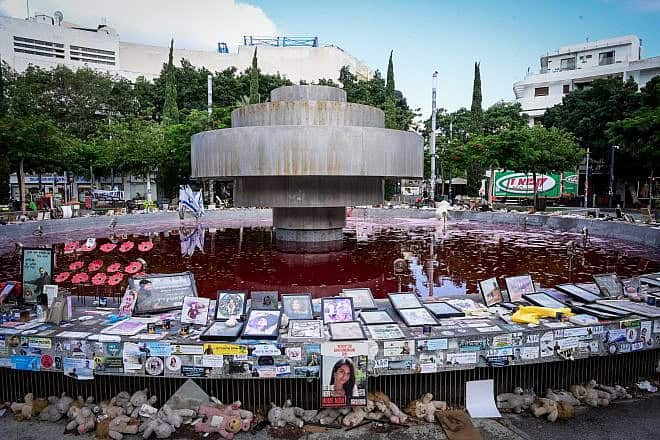View of the Dizengoff square fountain which was colored red overnight, as a protest for the release of Israelis held kidnapped by Hamas terrorists in Gaza, July 14, 2024. Photo by Avshalom Sassoni/Flash90.