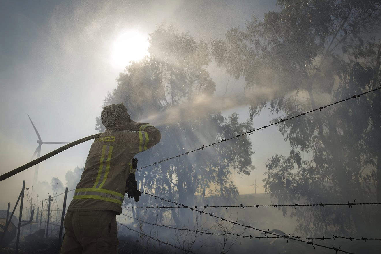 Firefighters work to extinguish wildfires following a missile attack from Lebanon in the Golan Heights, July 20, 2024. Photo by Michael Giladi/Flash90.