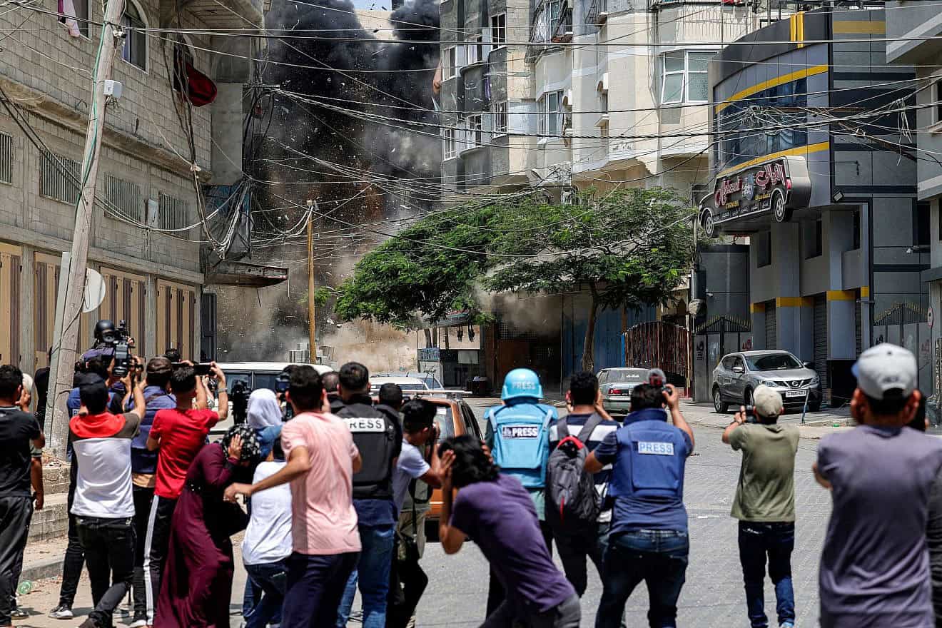 Journalists during an Israeli airstrike in Gaza City amid the conflict with Iran-backed Palestinian Islamic Jihad, Aug. 6, 2022. Photo by Mohammed Abed/AFP via Getty Images.