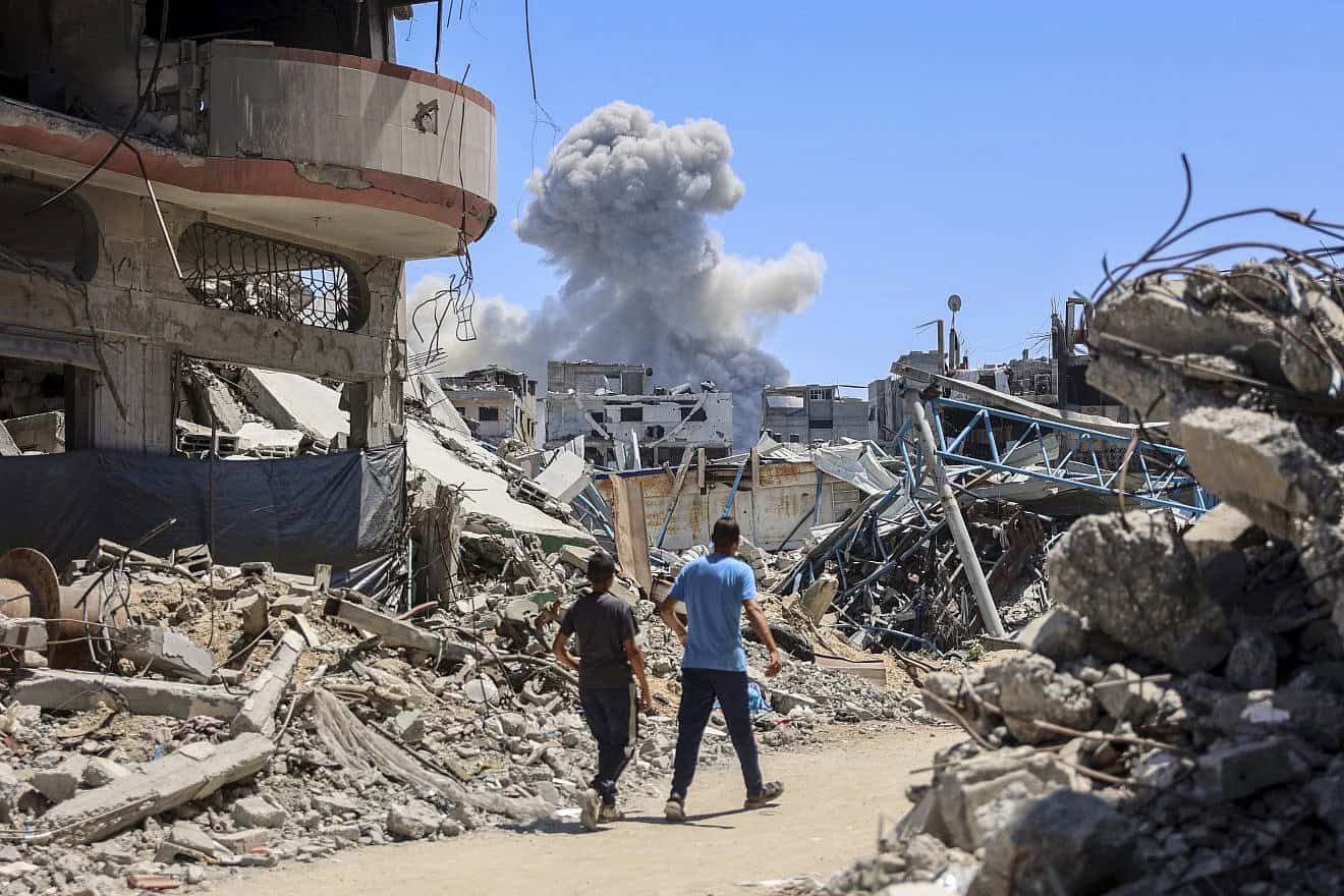Smoke billows over Gaza City's eastern Shejaiya neighborhood following an Israeli airstrike, June 22, 2024. Photo by Omar Al-Qattaa/AFP via Getty Images.