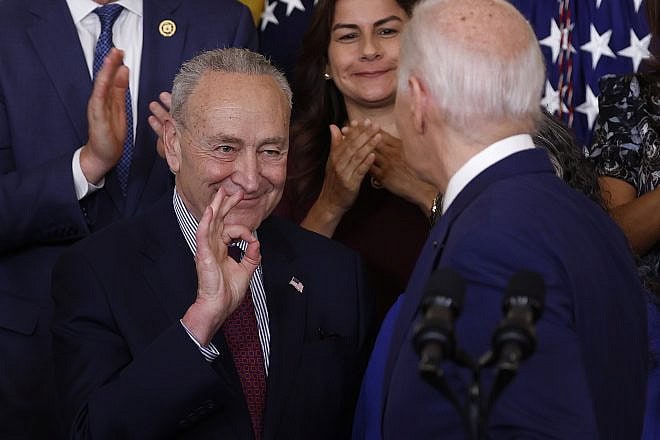 Senate Majority Leader Charles Schumer (D-N.Y.) motions to President Joe Biden after he delivered remarks at an event in the East Room at the White House marking the 12th anniversary of the Deferred Action for Childhood Arrivals (DACA) program, June 18, 2024. Photo by Kevin Dietsch/Getty Images.