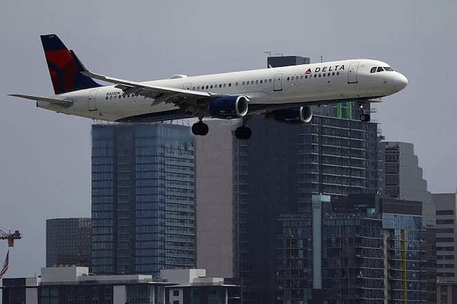 A Delta Airlines Airbus A321-211 aircraft approaches San Diego International Airport for a landing from Atlanta on June 28, 2024 in San Diego. Photo by Kevin Carter/Getty Images.