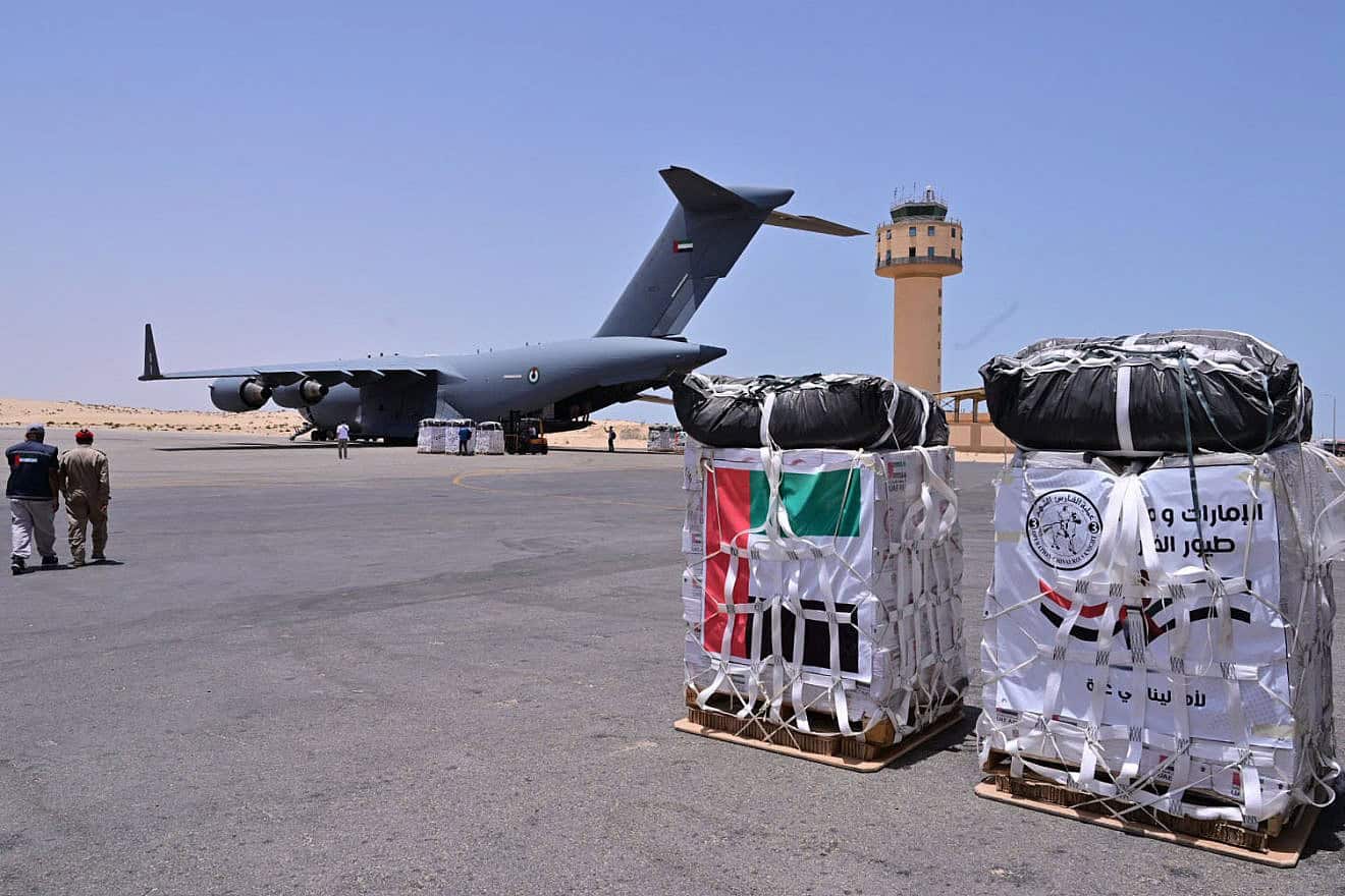 Staff members unload aid for the Gaza Strip from an United Arab Emirates military cargo plane on the tarmac of Egypt's el-Arish airport in the north Sinai Peninsula, July 4, 2024. Photo by Giuseppe Cacace/AFP via Getty Images.