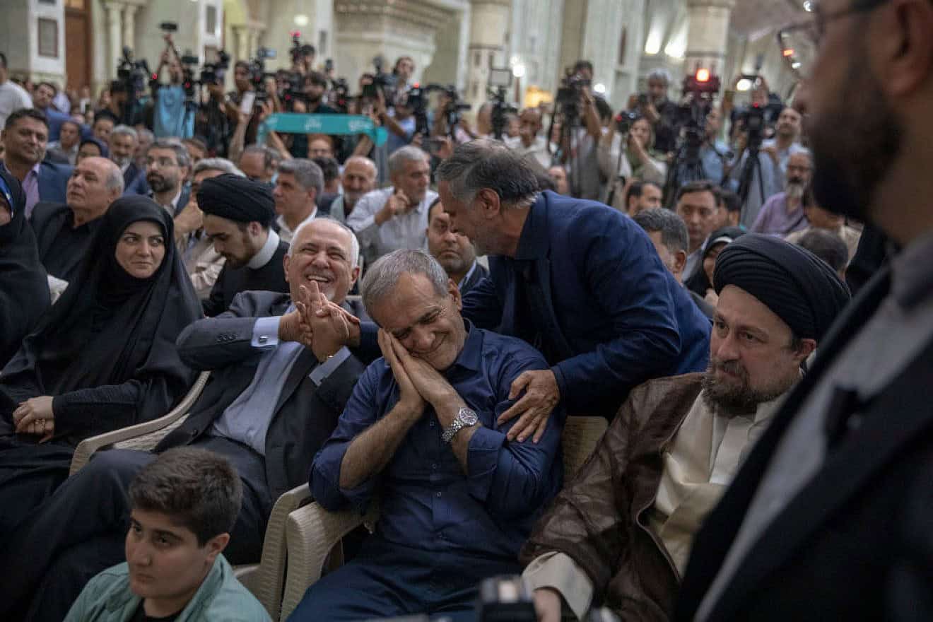 Newly-elected Iranian President Masoud Pezeshkian gestures during a visit to the shrine of the Islamic Republic's founder Ayatollah Ruhollah Khomeini in Tehran on July 6, 2024. Credit: Majid Saeedi/Getty Images.