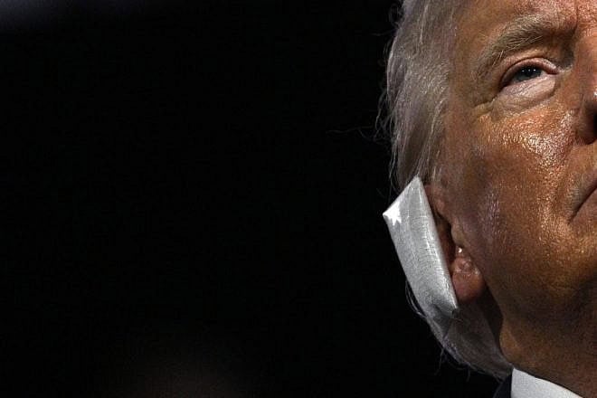 A bandage is seen on the ear of former President and 2024 Republican presidential candidate Donald Trump after he was wounded in an assassination attempt, July 15, 2024. Credit: Brendan Smialowski / AFP via Getty Images.