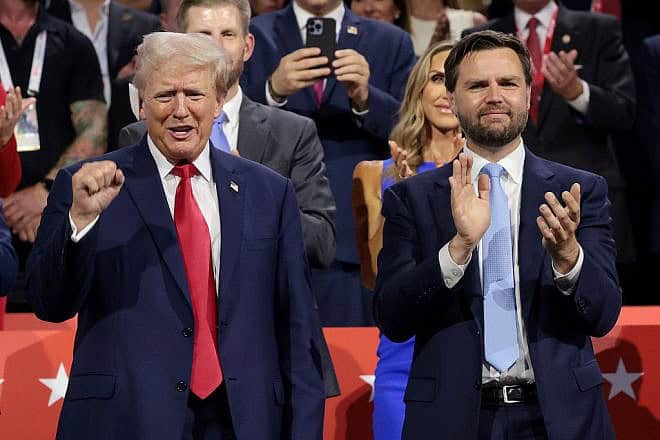 Republican presidential candidate former President Donald Trump and Republican vice-presidential candidate Sen. J.D. Vance (R-Ohio) appear on the first day of the Republican National Convention at the Fiserv Forum in Milwaukee, Wisconsin on July 15, 2024. Credit: Win McNamee/Getty Images.