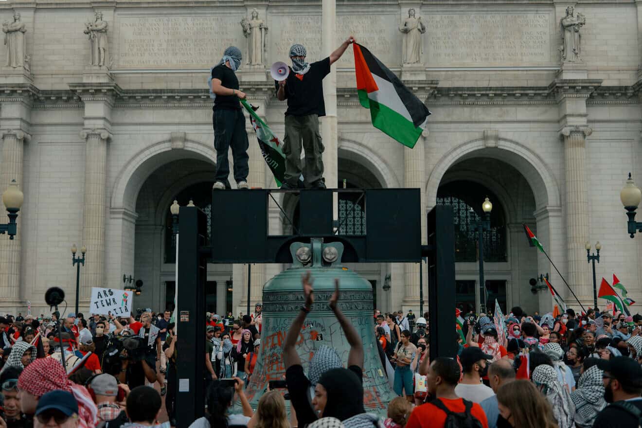 A protester waves a Palestine flag during a demonstration outside the Capitol Building following Israeli Prime Minister Benjamin Netanyahu's address during a joint session of Congress in Washington, D.C. on July 24, 2024. Photo by Hossein Fatemi/Middle East Images/AFP via Getty Images.