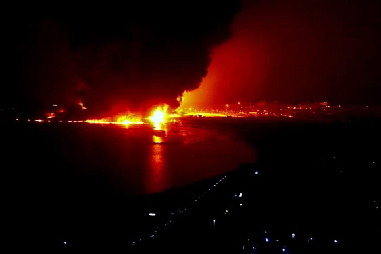 In this handout screengrab released by the Houthi group Media Center on July 20, 2024, a fire rises after airstrikes carried out by Israeli warplanes targeting oil storage facilities in the port city of Al Hudaydah, Yemen. Photo by Handout/Houthi Media Center via Getty Images.