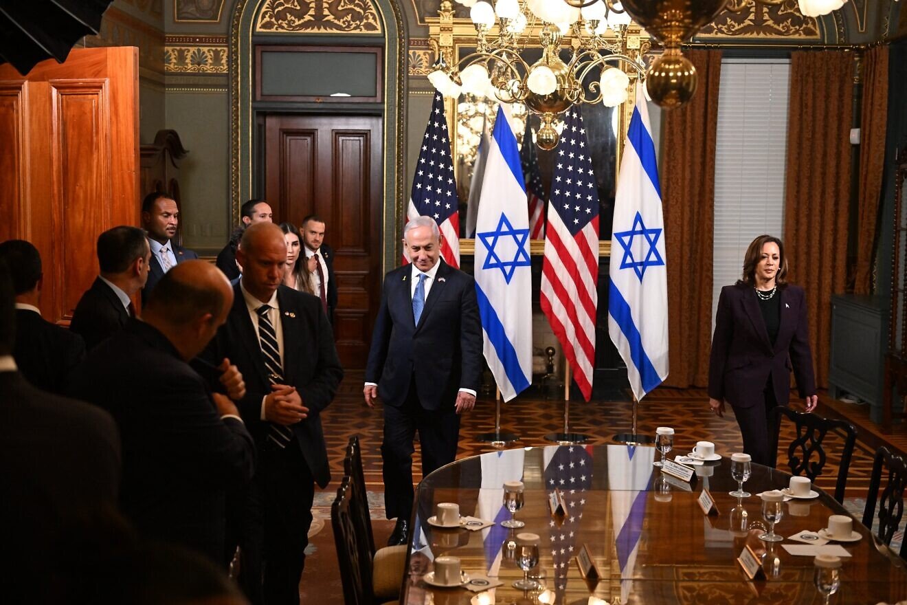 Israeli Prime Minister Benjamin Netanyahu and U.S. Vice President Kamala Harris walk to their seats prior to talks in the vice president's ceremonial office at the Eisenhower Executive Office Building in Washington, D.C, on July 25, 2024. Photo by Roberto Schmidt/AFP via Getty Images.