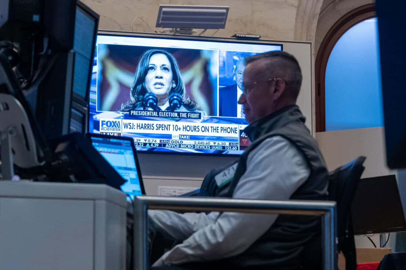 Traders work on the floor of the New York Stock Exchange as a picture of Vice President Kamala Harris is displayed on a television screen on July 22, 2024.
Credit: Spencer Platt / Getty Images.