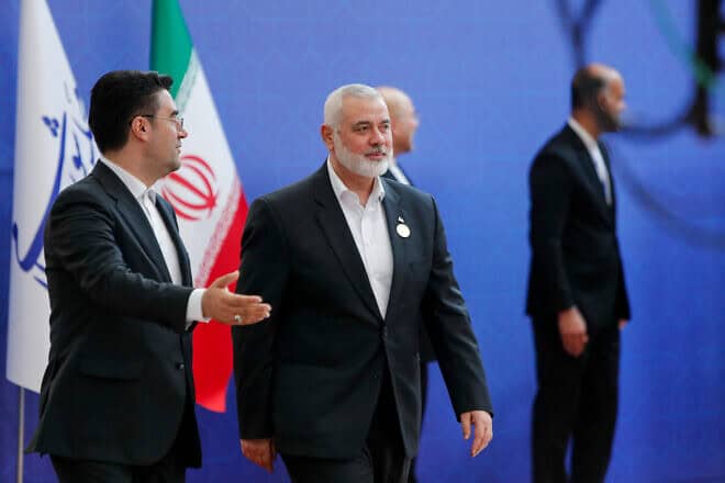 Hamas leader Ismail Haniyeh arrives to participate in the swearing in ceremony for the new Iranian President, Masoud Pezeshkian, at the parliament in Tehran on July 30, 2024. Photo by Saman/Middle East Images/AFP via Getty Images.