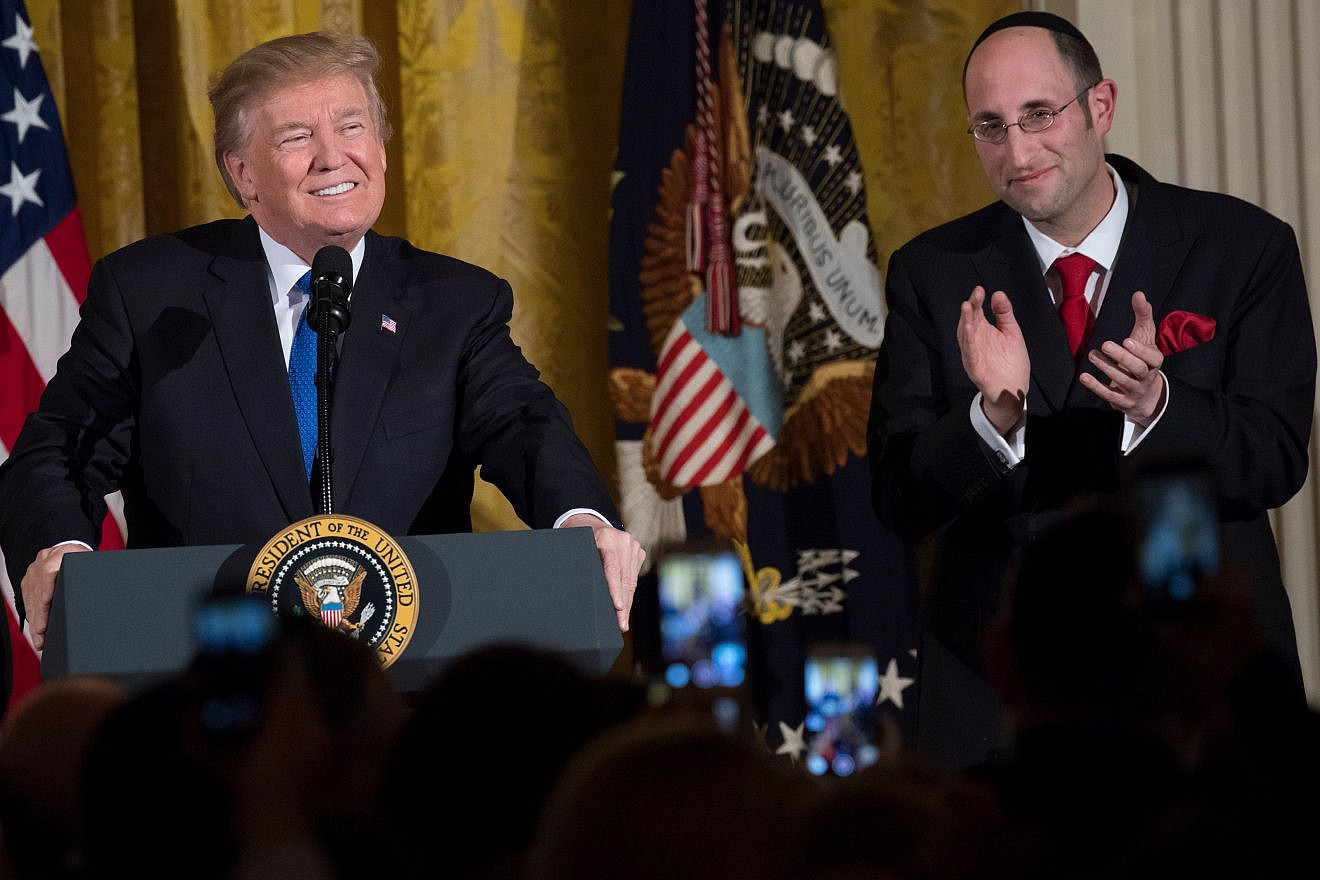 U.S. President Donald Trump speaks alongside Rabbi Meir Soloveichik at a Chanukah reception in the East Room of the White House on Dec. 7, 2017. Photo by Saul Loeb/AFP via Getty Images.