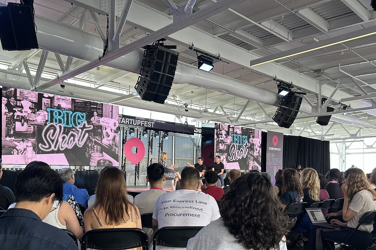 Heather Reisman, founder and CEO Indigo Books and Music, interviews with Shopify president Harley Finkelstein and David Segal, an entrepreneur, during a live-taping of their podcast Big Shot on July 12, 2024 at Startupfest in Montreal. Photo by Izzy Salant.