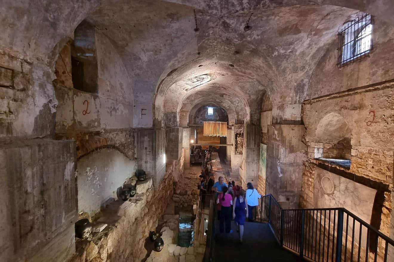 Visitors view the “Umbilicus” contemporary Israeli art exhibition in the Kishle building, part of the Tower of David Jerusalem Museum, July 9, 2024. Photo by Sharon Altshul.