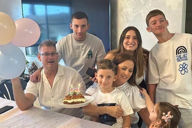 Matan Angrest (rear left) with his parents, sister Adi, 18, and brothers Roi, 9, and Ofir, 16. Credit: Courtesy of the Hostages and Missing Families Forum.