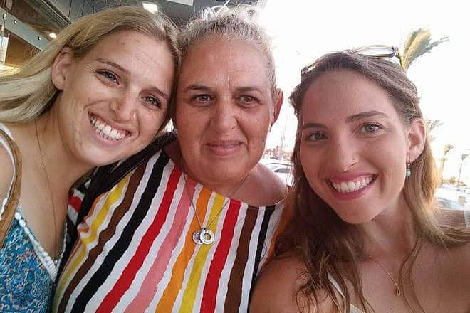Hamas hostage Doron Steinbrecher (left) with her mother Simona (center) and her sister Yamit Ashkenazi. Credit: The Hostage and Missing Families Forum.