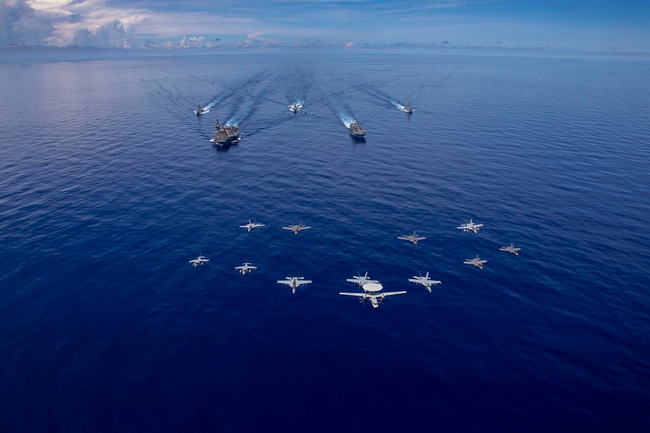 The Abraham Lincoln Carrier Strike Group and Italy’s Cavour Carrier Strike Group sail in formation in the Pacific Ocean, Aug. 9, 2024. Credit: Mass Communication Specialist Seaman Apprentice Daniel Kimmelman/U.S. Navy Photo.