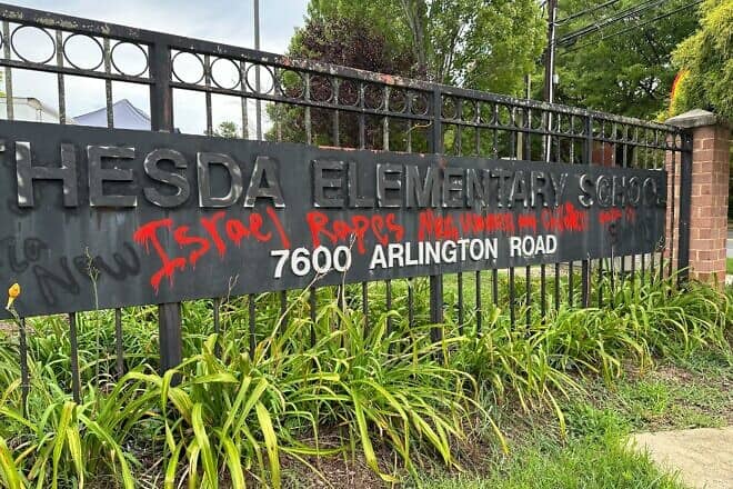 Anti-Israel graffiti was spray-painted in red on the main sign of Bethesda Elementary School in Maryland, August 2024. Credit: Courtesy of the Anti-Defamation League.