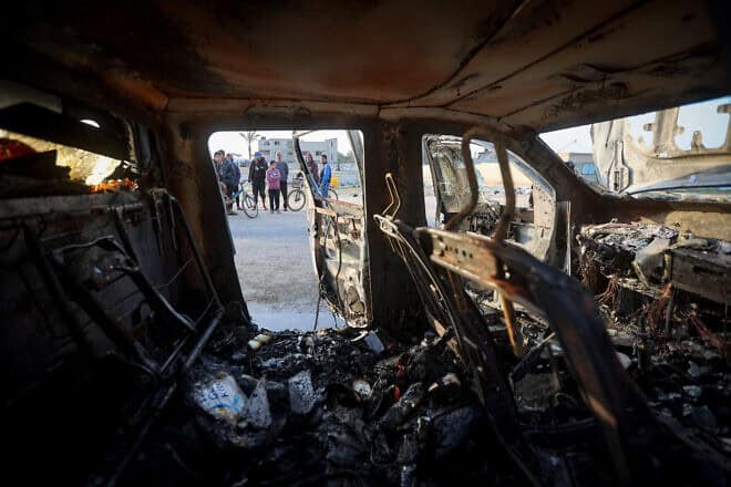 Palestinians inspect a World Central Kitchen vehicle that was hit by an Israeli airstrike in the Gaza Strip on April 2, 2024. Photo by Atia Mohammed/Flash90.