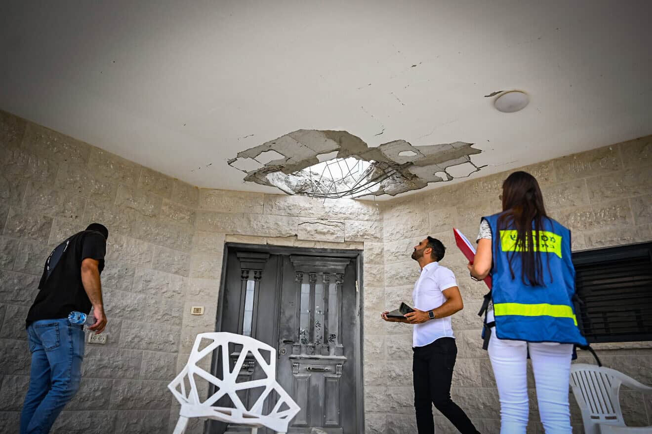 People at the site of a damaged house following a missile attack from Lebanon, in Moshav Manot, northern Israel, Aug. 25, 2024. Photo by Flash90.