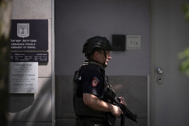 A police officer stationed in front of the Israeli embassy in Belgrade following an attack in the area, June 29, 2024. Photo by Oliver Bunic/AFP via Getty Images.