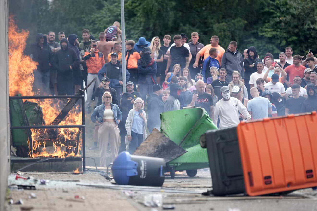 Anti-immigration protesters are seen during riots outside of the Holiday Inn Express in Manvers, which is being used as an asylum hotel, on Aug. 4, 2024 in Rotherham, United Kingdom. Photo by Christopher Furlong/Getty Images.