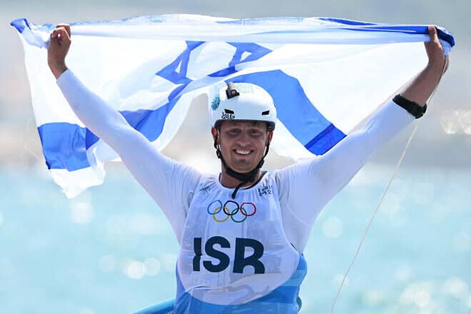 Tom Reuveny of Team Israel celebrates winning the gold medal in the Men's Windsurf iQFoil class final on day eight of the Olympic Games Paris 2024 at Marseille Marina on August 2024 in Marseille, France. Photo by Clive Mason/Getty Images.