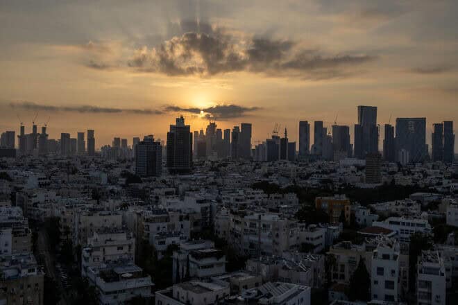 The sun rises in Tel Aviv amid regional tensions during the ongoing war between Israel and the Hamas terrorist movement in the Gaza Strip on Aug. 7, 2024. Photo by Oren Ziv/AFP via Getty Images.
