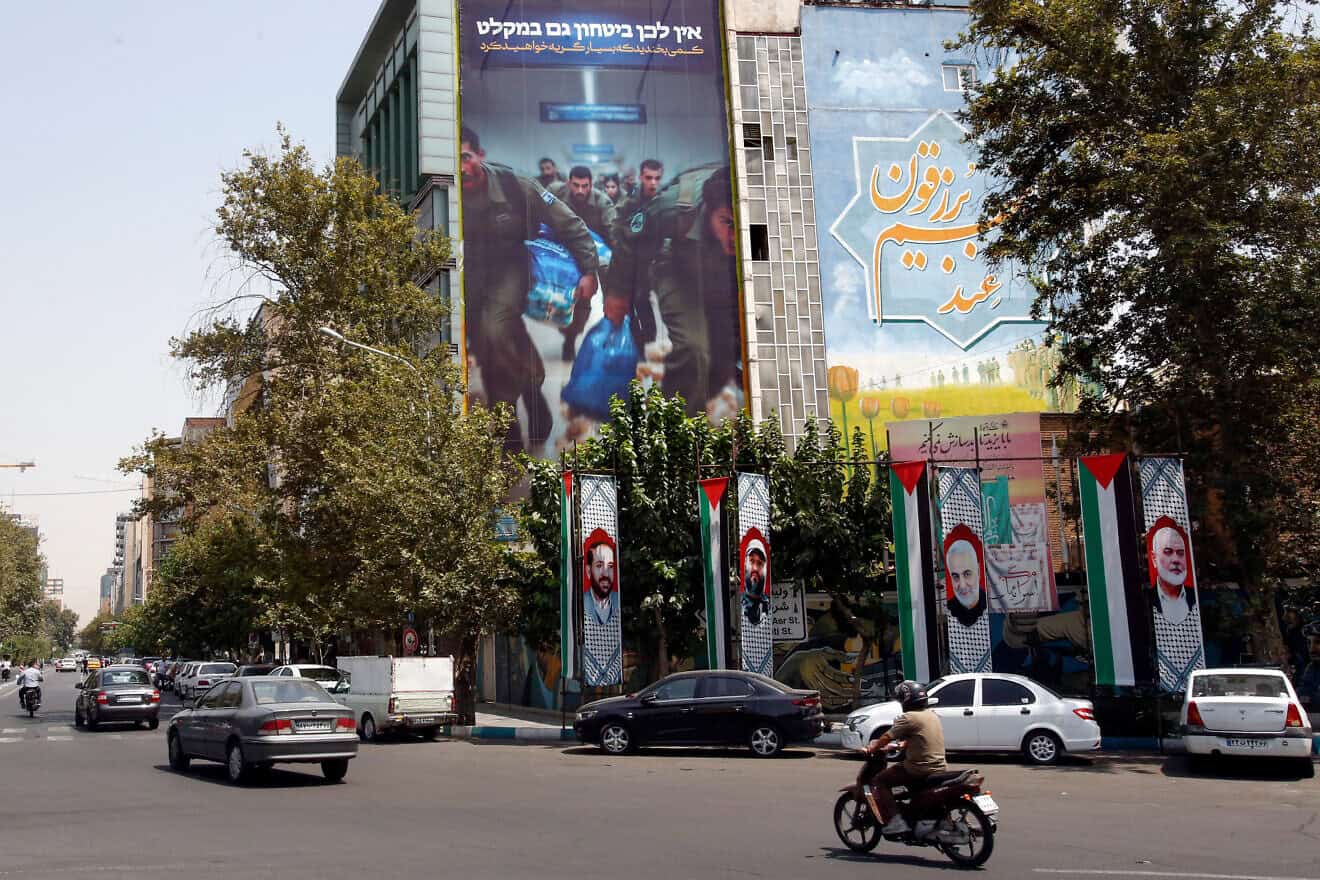 An anti-Israel billboard showing IDF soldiers running for shelter on a building in Tehran's Palestine Square, Aug. 8, 2024. Photo by AFP via Getty Images.