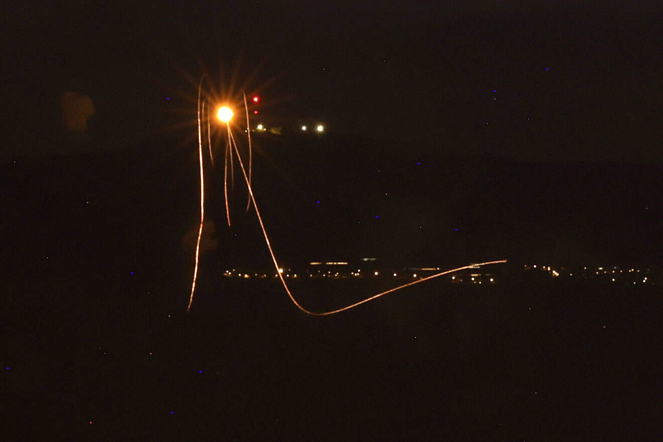 Rockets fired from southern Lebanon are intercepted by Israel's Iron Dome air defence system over the Upper Galilee region in northern Israel on Aug. 23, 2024. Photo by Jalaa Marey/AFP via Getty Images.