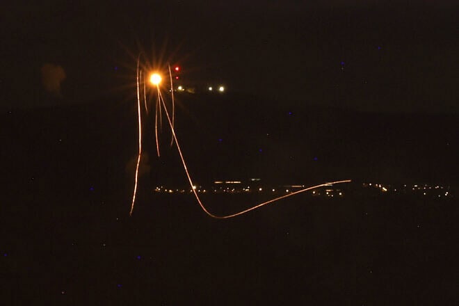 Rockets fired from southern Lebanon are intercepted by Israel's Iron Dome air defence system over the Upper Galilee region in northern Israel on Aug. 23, 2024. Photo by Jalaa Marey/AFP via Getty Images.