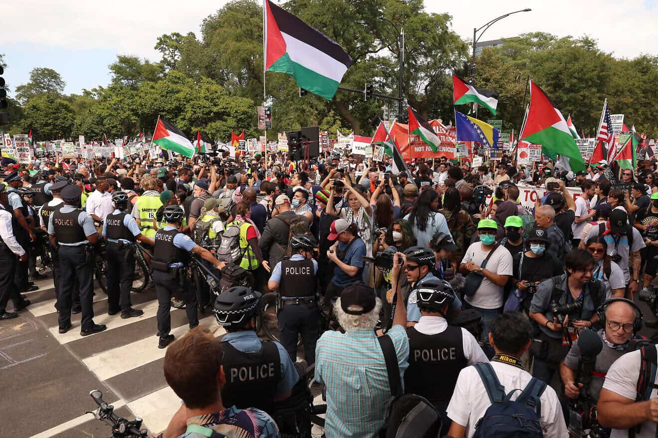 Police and demonstrators prepare for start of the "March on the DNC" during the first day of the Democratic National Convention in Chicago on Aug. 19, 2024. Photo by Scott Olson/Getty Images.