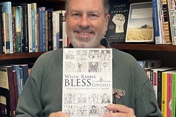 Howard Mortman and his 2020 book, “When Rabbis Bless Congress.” Photo by Emily Mortman.