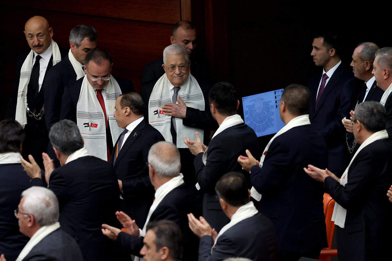 Palestinian Authority leader Mahmoud Abbas (center) arrives to deliver a speech at Grand National Assembly of Turkey in Ankara on Aug. 15, 2024.  Photo by Adem Altan/AFP via Getty Images.