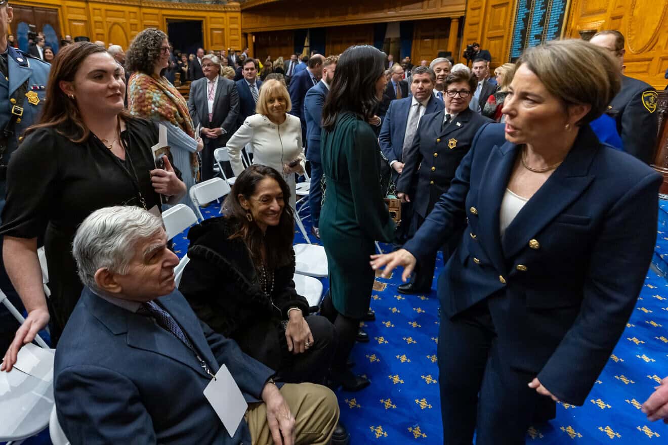 Massachusetts Gov. Maura Healey speaks with the state's former governor, Michael Dukakis, at her first annual State of the Commonwealth address at the State House on Jan. 17, 2024. Credit: Joshua Qualls/Governor’s Press Office.