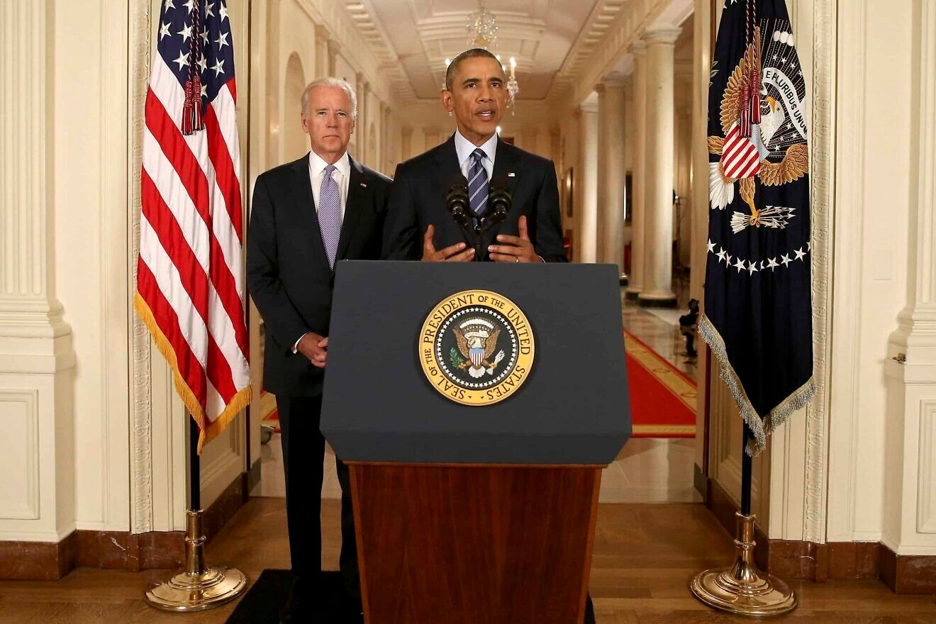 President Barack Obama, standing with Vice President Joe Biden, conducts a press conference in the East Room of the White House on the Iran nuclear deal on July 14, 2015. Photo by Andrew Harnik/POOL via Getty Images.