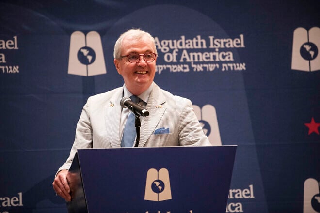 New Jersey Gov. Phil Murphy speaks at an Agudath Israel of America event on the sidelines of the Democratic National Convention in Chicago on Aug. 20, 2024. Credit: Agudah.