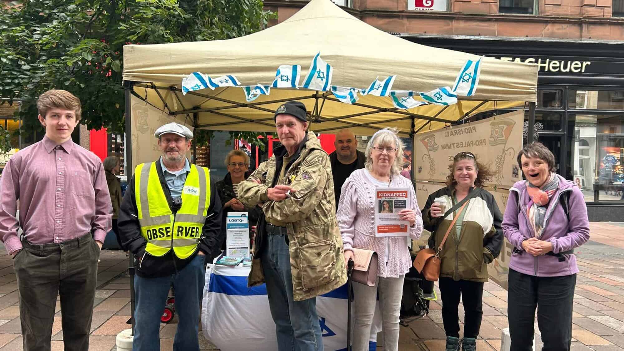 Volunteers at the Glasgow Friends of Israel pro-peace stall on Buchanan Street on Aug. 17, 2024. Photo by Amelie Botbol.