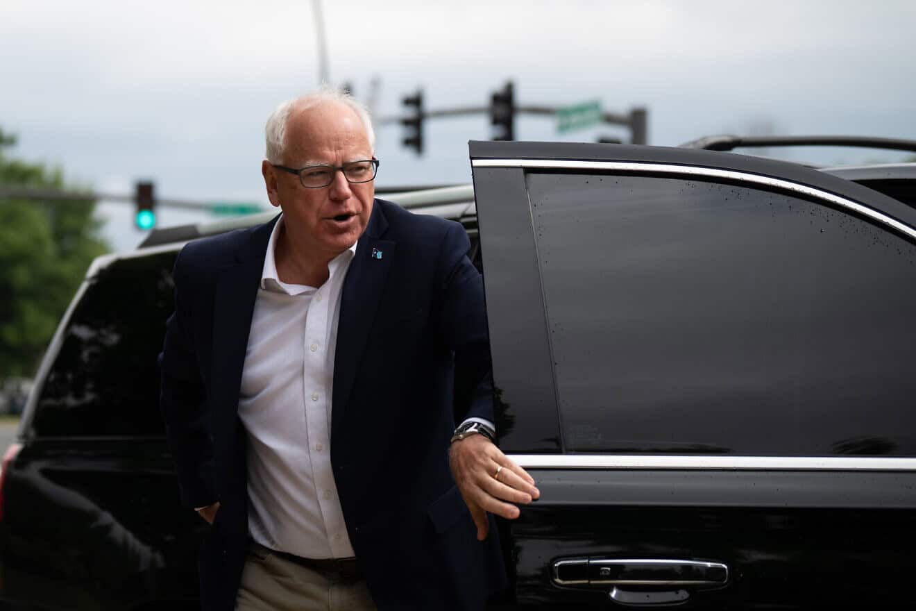 Minnesota Gov. Tim Walz arrives to speak at a press conference regarding new gun legislation at City Hall on in Bloomington, Minn., on Aug. 1, 2024. Photo by Stephen Maturen/Getty Images.