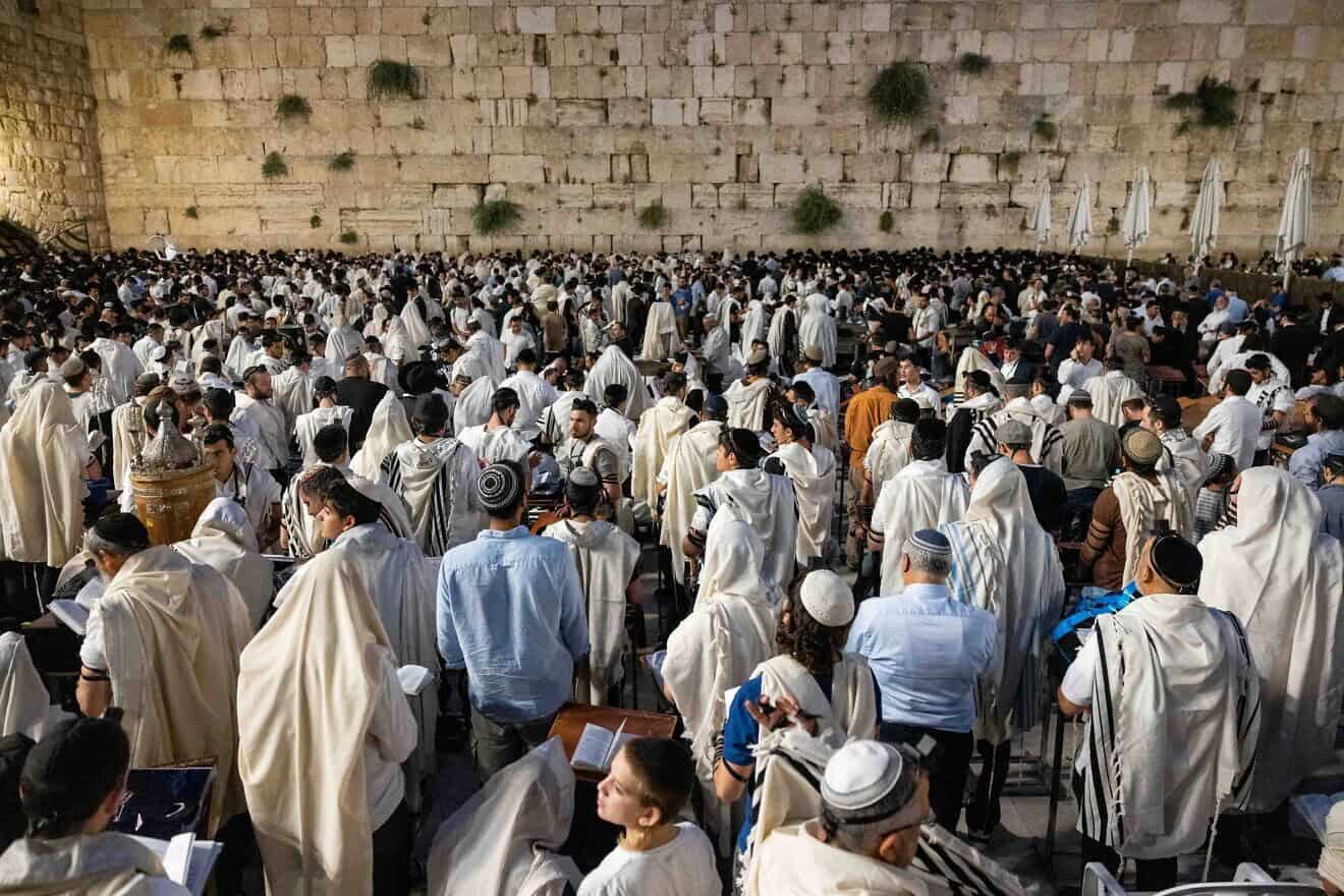 Jewish men pray during Tisha B'Av at the Western Wall in the Old City of Jerusalem, July 27, 2023. Photo by Chaim Goldberg/Flash90.