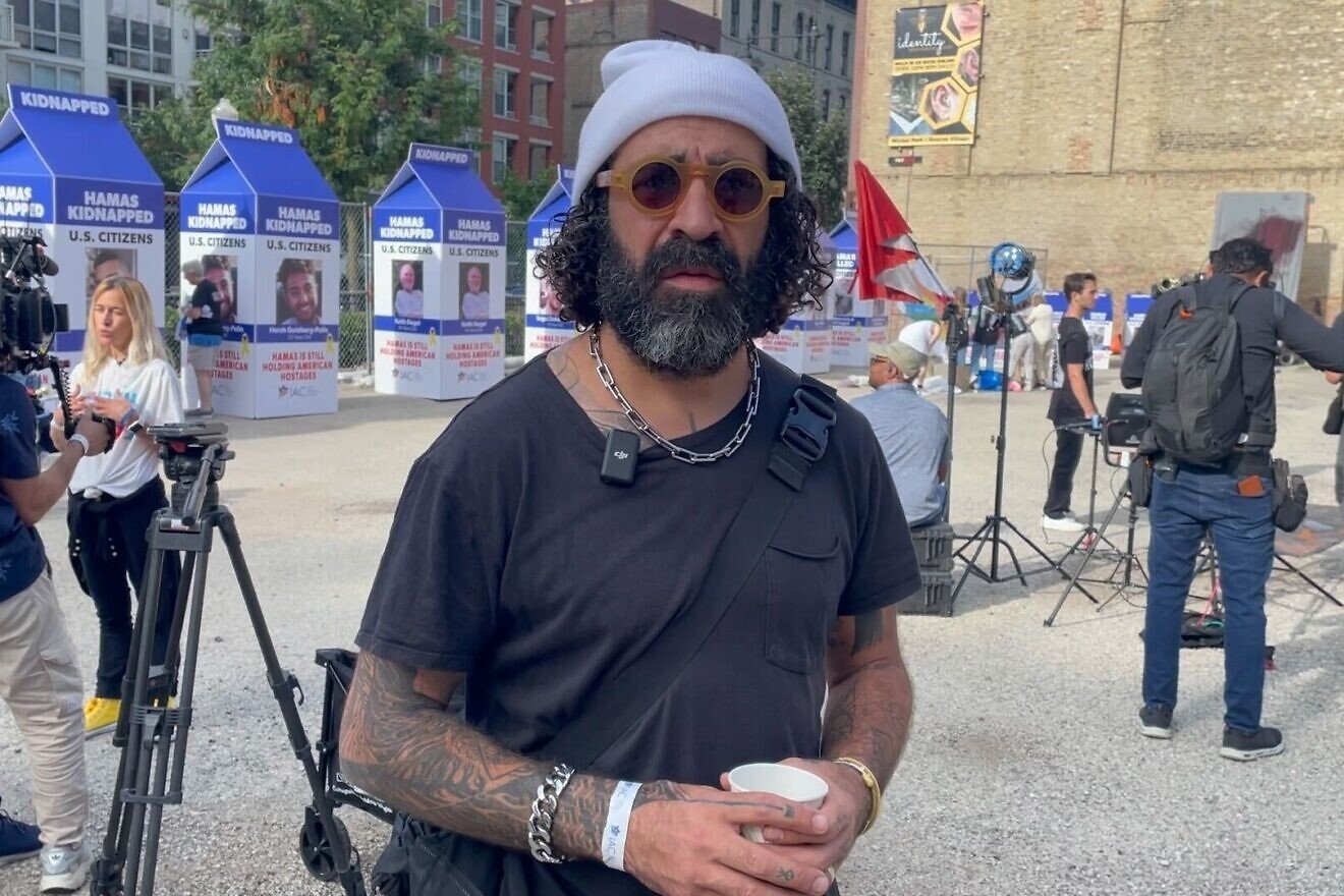 Los Angeles-based Israeli artist Tomer Peretz at a "hostage square" installation near the Democratic National Convention in Chicago on Aug. 20, 2024. Photo by Mike Wagenheim.