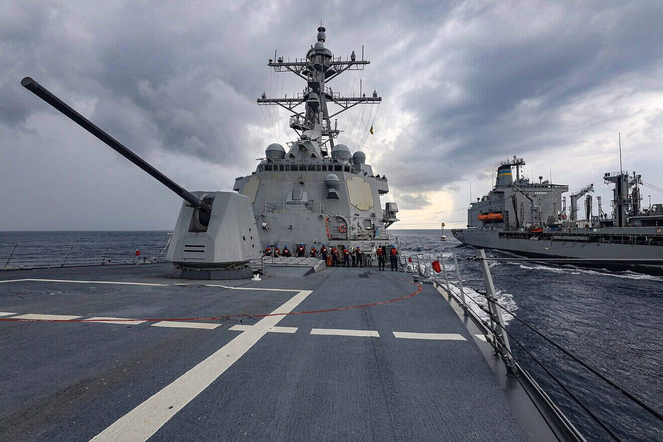 The Arleigh Burke-class guided-missile destroyer “USS Dewey” (DDG 105), left, steams alongside the fleet replenishment oiler “USNS Big Horn” (T-AO 198) during an underway replenishment while operating in the South China Sea, Oct. 23, 2023. U.S. Navy Photo by Mass Communication Specialist 1st Class Greg Johnson.