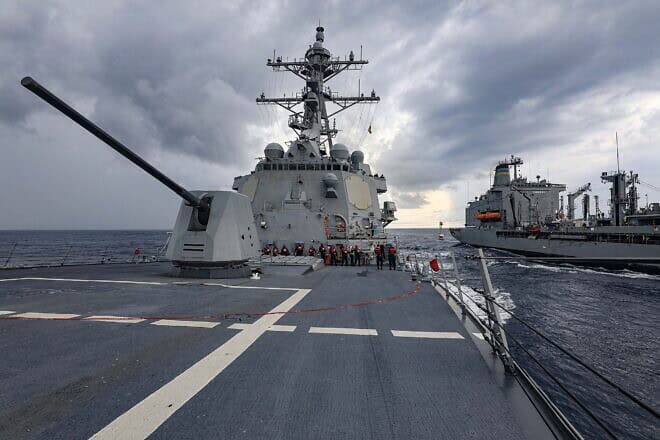 The Arleigh Burke-class guided-missile destroyer “USS Dewey” (DDG 105), left, steams alongside the fleet replenishment oiler “USNS Big Horn” (T-AO 198) during an underway replenishment while operating in the South China Sea, Oct. 23, 2023. U.S. Navy Photo by Mass Communication Specialist 1st Class Greg Johnson.