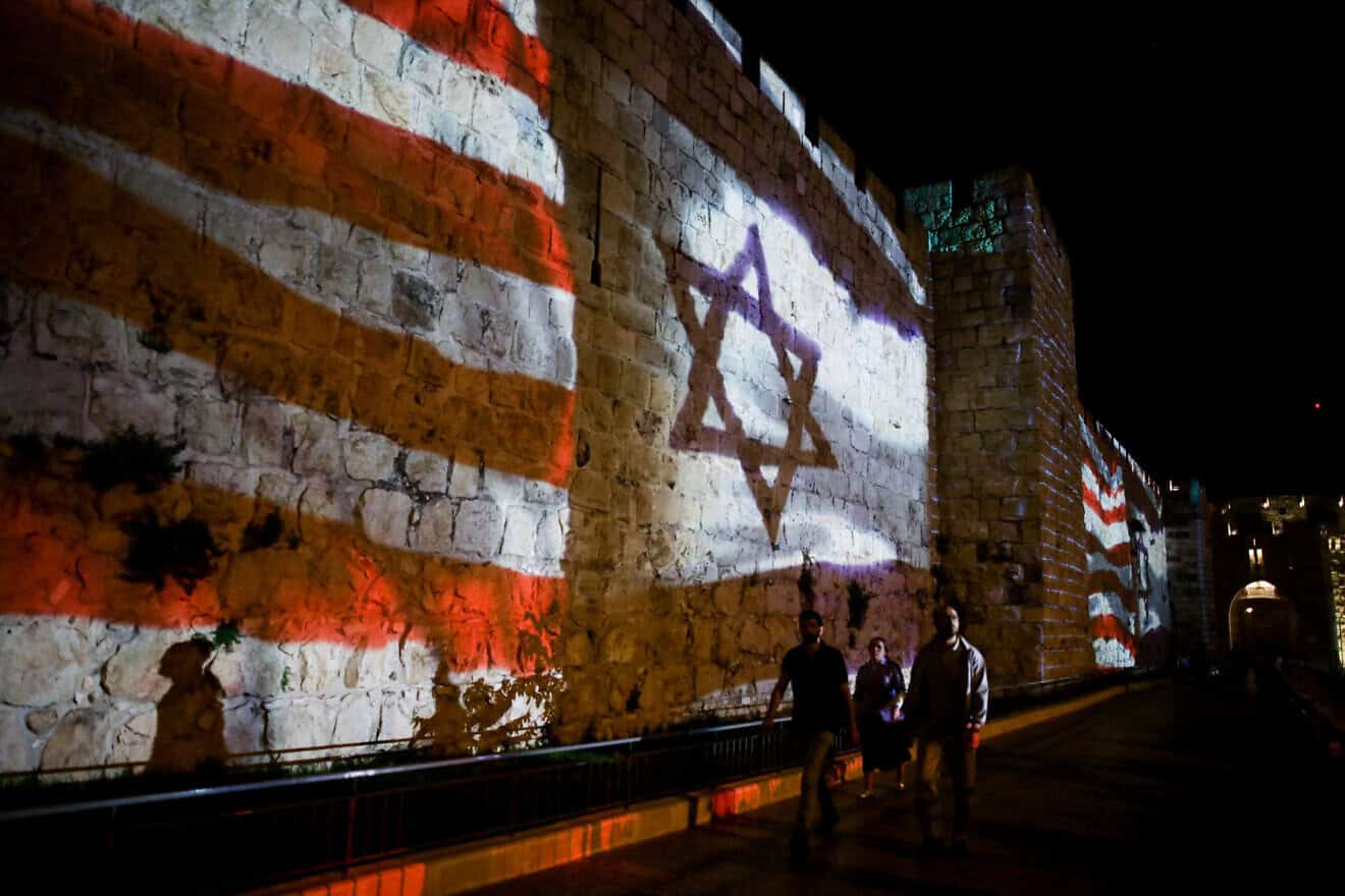 The Israeli and American flag are screened on the walls of Jerusalem's Old City to mark one year since the transfer of the U.S. embassy from Tel Aviv to Jerusalem, May 14, 2019. Photo by Aharon Krohn/Flash90.